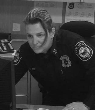 Vicki Yost in uniform at her desk